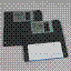 Two black 3.5-inch 1.44 MB floppy disks on a plain gray surface. One disk is labelled and slightly overlaps the other.